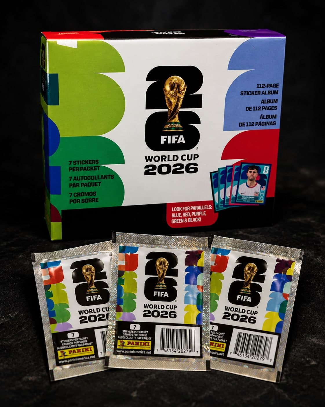 FIFA World Cup 2026 sticker box with 3 sealed packs on a black slate surface — official Panini collection